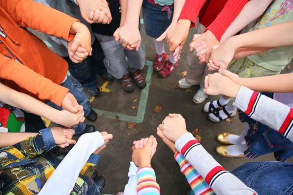 Circle from children, who are held for hands — Stock Photo, Image