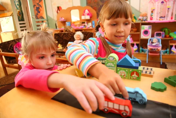 Two girls in playroom — Stock Photo, Image