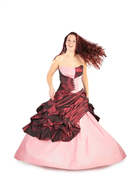 Mulher em um vestido rosa longo com um cabelo voador — Fotografia de Stock