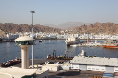 Shipping dock near mountains general view from ship summer day clipart