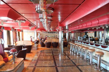 Cafe with bright multicolored interior, bar and red celling gene clipart