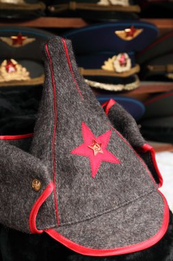 Budenny hat Red Army uniform with red star and police hats on ba clipart