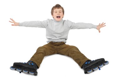 Little roller boy sitting with hands moved at sides and crying i clipart