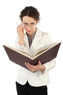 Young serious woman arranging glasses and holding big book and p clipart