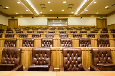 Conference halls with magnificent leather armchairs and wooden t clipart