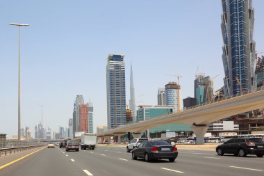 DUBAI - APRIL 18: general view on trunk road, skyscrapers and Bu clipart