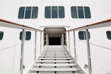 Entrance with rails and stairs in big cruise passenger liner clipart