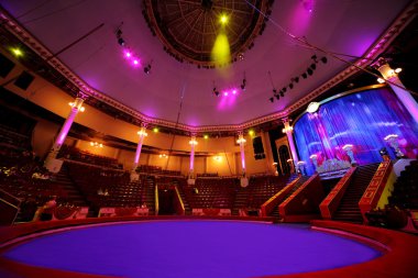 Circle arena in circus purple light lamps general view on cellin clipart