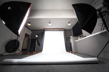 Interior of professional photo studio with white background gene clipart