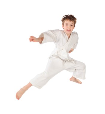 Karateka boy in white kimono jumping isolated on white backgroun clipart