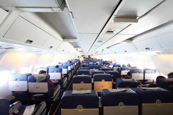 Airplane cabin with passengers general view — Stock Photo, Image