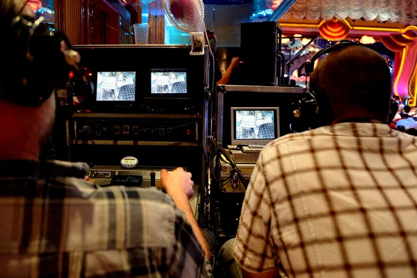 Two video operators controlling camera at performance show view — Stock Photo, Image