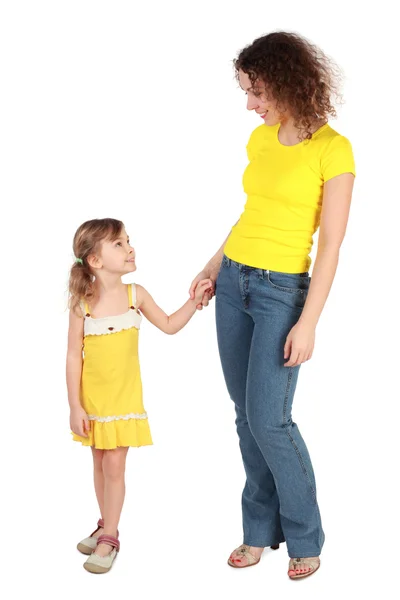 Mother and daughter holding for hands looking to each other and — Stock Photo, Image