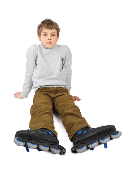 Kis roller fiú ült és nézett kamera elszigetelt Pünkösd — Stock Fotó