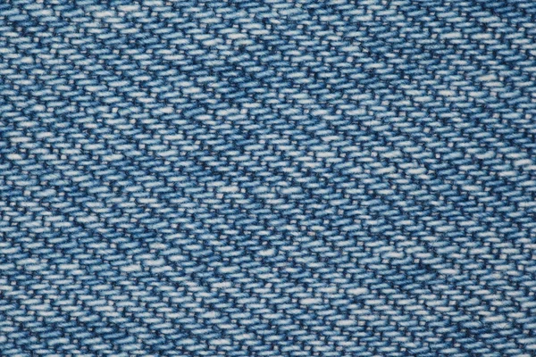 Stuk van blauw denim stof structuur — Stockfoto