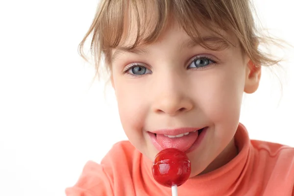 Girl eating red lollipop, half body, front view, isolated on whi — Stock Photo, Image