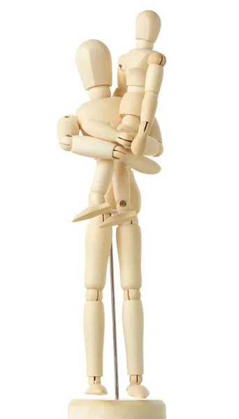 Drewniane figurki dziecko siedzi na ręce jego rodziców, pełne BZT — Zdjęcie stockowe