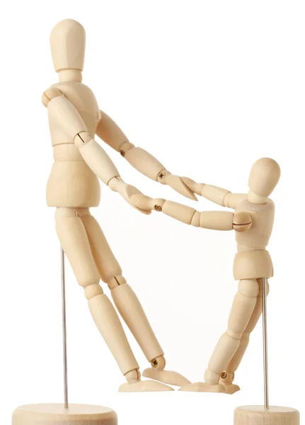 Wooden figures of parent and child holding for hands, full body, — Stock Photo, Image