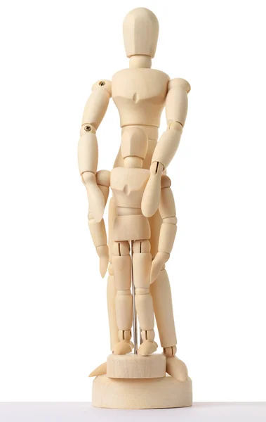 stock image Wooden figures of parent embracing his child from back, full bod