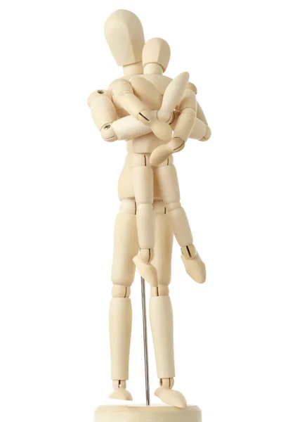 Drewniane figurki z rodzic załadowane jego dziecko z tyłu, na ciało, — Zdjęcie stockowe
