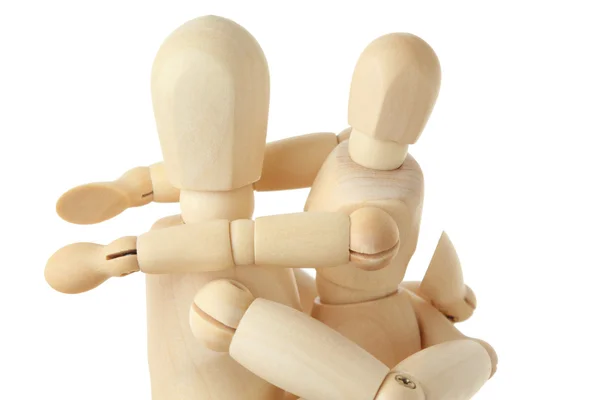 Wooden figures of child embracing his parent by shoulders, half — Stock Photo, Image