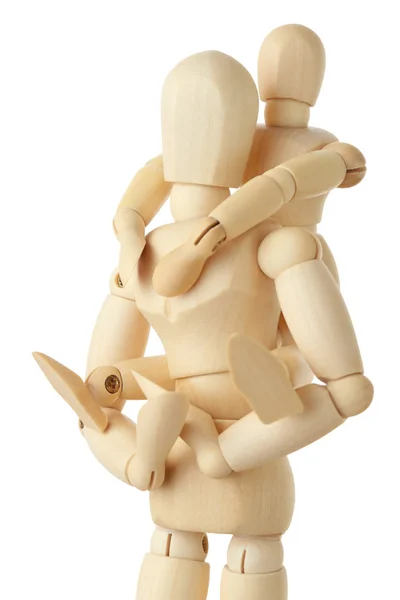 Wooden figures of child sitting on back of his parent and embrac — Stock Photo, Image