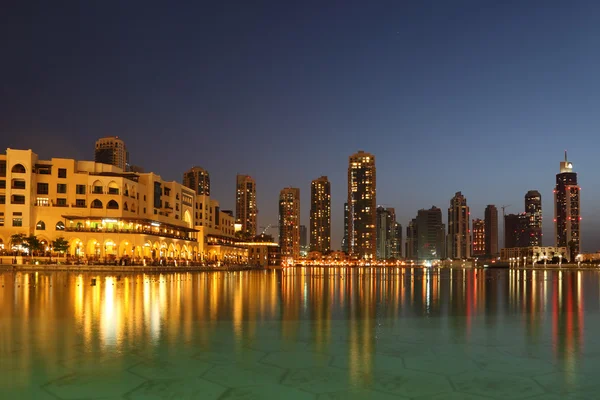 Dubai skyscrapers and other buildings at night time, view from w — Stock Photo, Image
