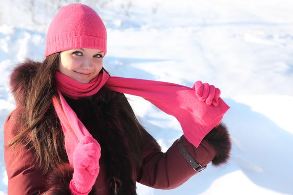Portrait of young beauty girl in pink scarf and hat smiling — Stock Photo, Image