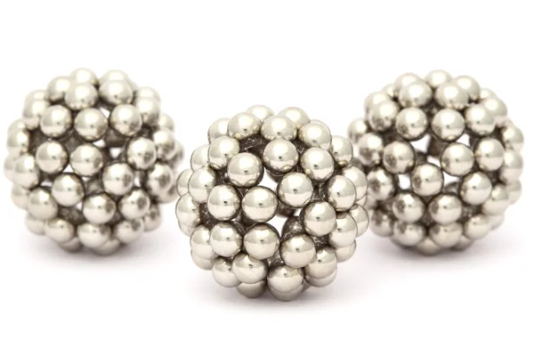 Three balls of metal segment assembled from neocube isolated on — Stock Photo, Image