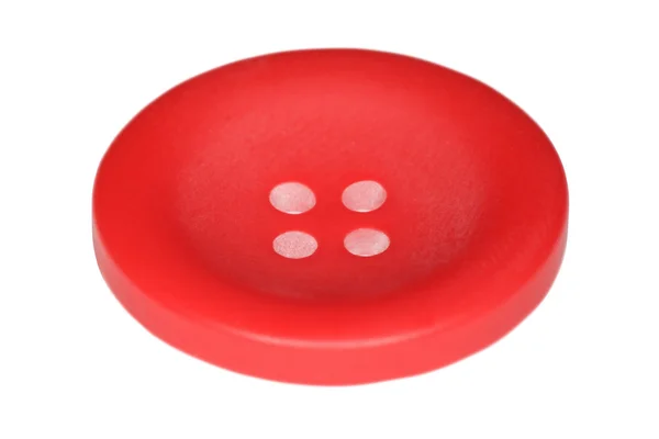Красная кнопка для одежды на белом фоне — стоковое фото