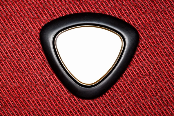 Dreieckiges Etikett auf rotem Textilstoff, Muster auf diagonalem — Stockfoto