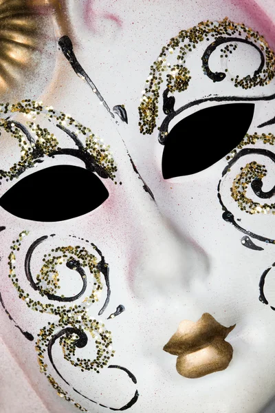 White Venetian mask with patterns, Lying on diagonal — Stock Photo, Image