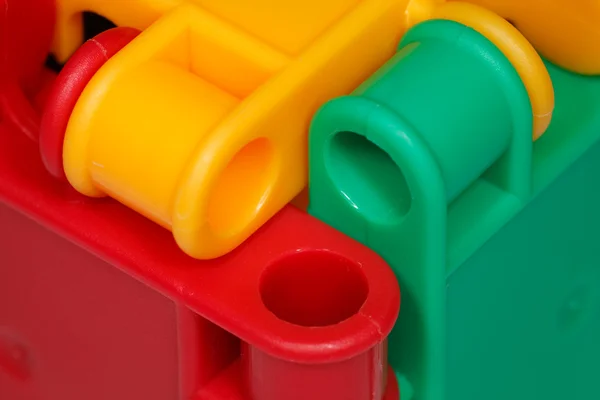 Juguetes de plástico de colores de primer plano — Foto de Stock