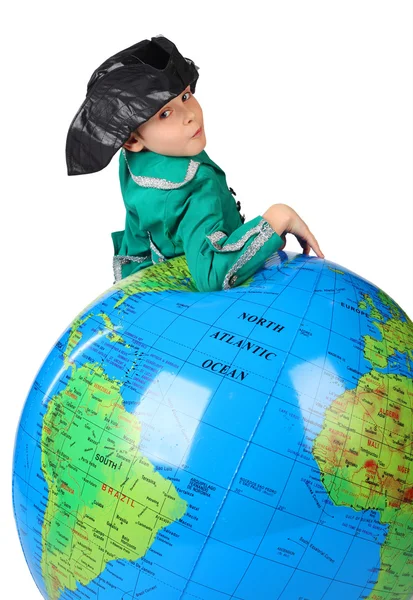 Boy in historical dress leans on inflatable globe isolated on wh — Stock Photo, Image