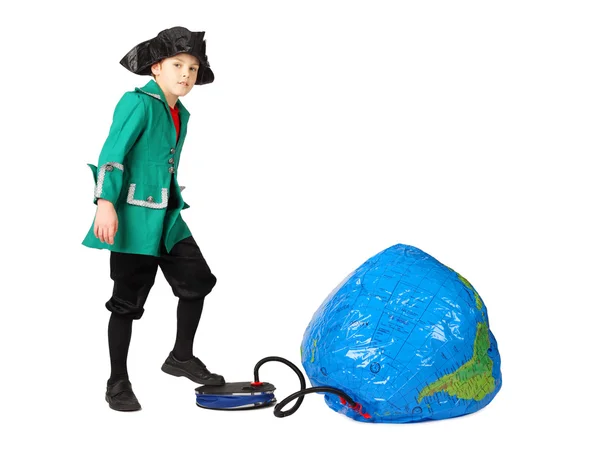 Little boy in historical dress pumping inflatable globe isolated — Stock Photo, Image