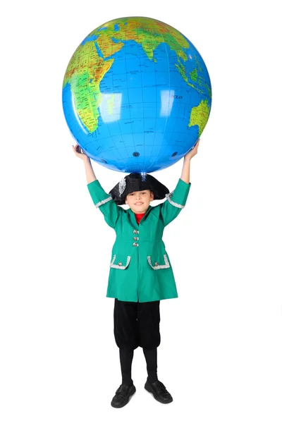 Little boy in historical dress holding big inflatable globe over — Stock Photo, Image