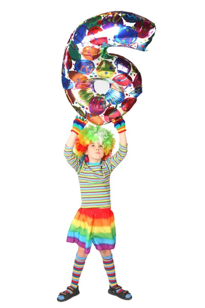 Boy in clown dress with balloon shape six over his head isolated — Stock Photo, Image