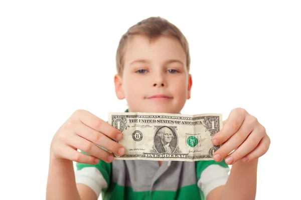 Usměvavý chlapec drží jeden dolar v obou rukou izolovaných na bílém ba — Stock fotografie