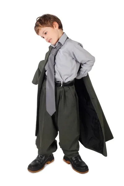 Little boy in big grey man's suit and boots dressing jacket isol — Stock Photo, Image
