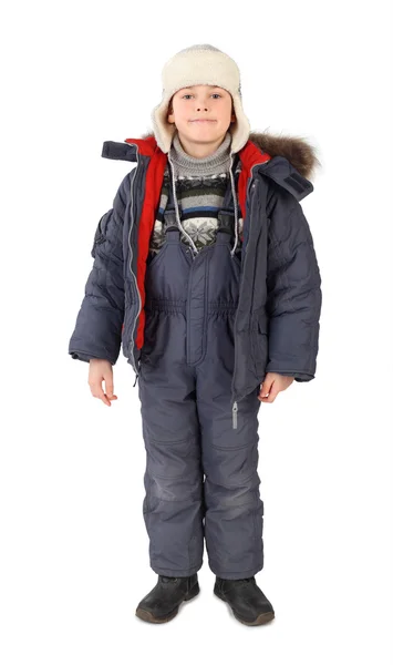Liten pojke i vinter klä står och ler isolerade på whit — Stockfoto
