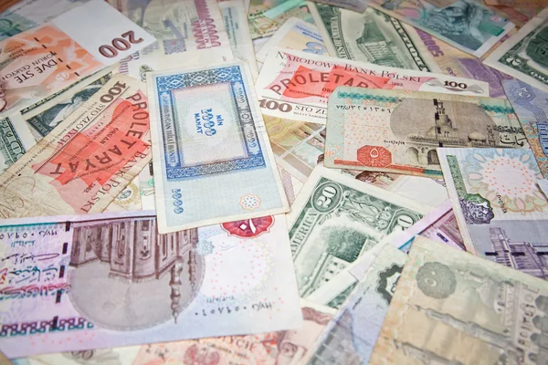 Tło z banknotów o różnych monetarnych waluty — Zdjęcie stockowe