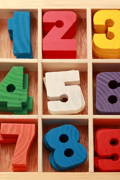Math game for junior age with colored wooden signs of numbers ve Royalty Free Stock Photos