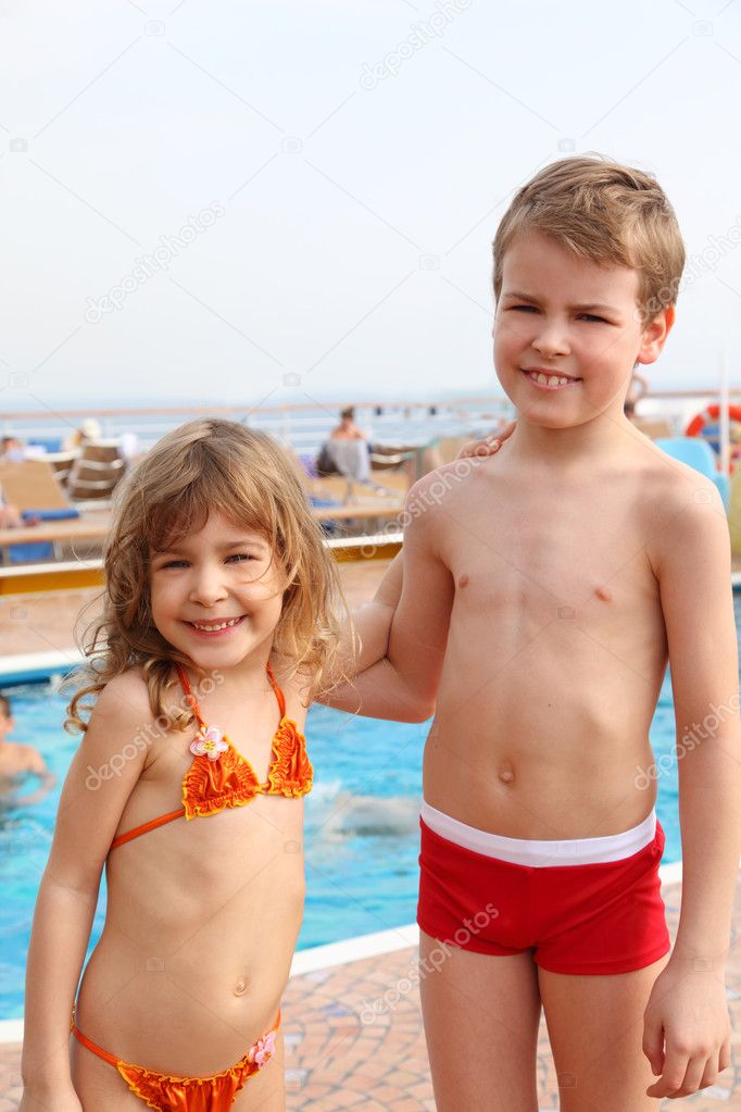 Caucasian little girl and boy standing on cruise ship and smilin Stock Photo Paha L 7936536