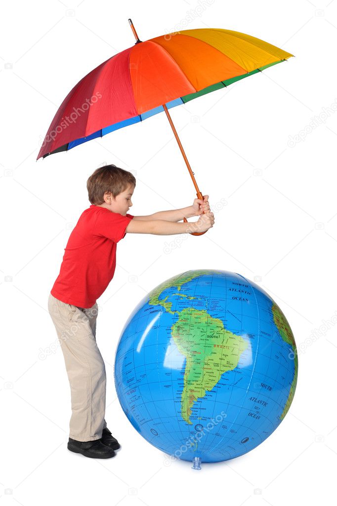 Boy in red shirt with multicolored umbrella and inflatable globe