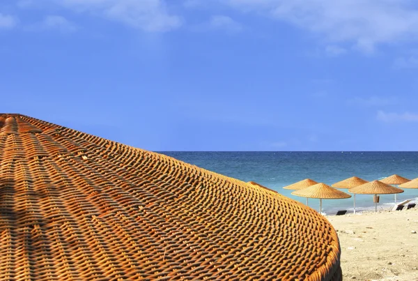 stock image Beach view behind umbrella