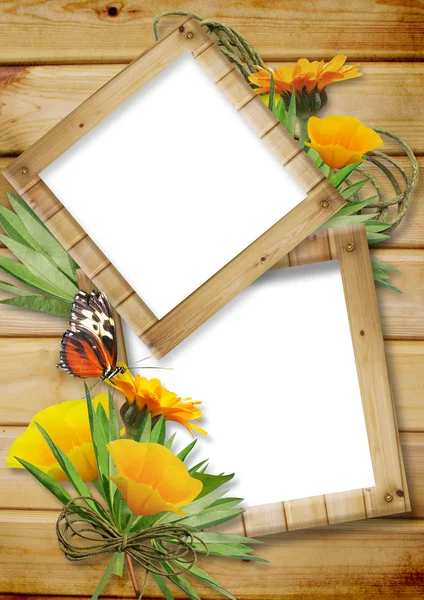 Photo frame on a wooden background with butterflies and flowers — Stock Photo, Image