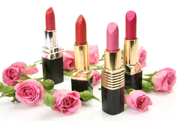Decorative cosmetics and roses Royalty Free Stock Images