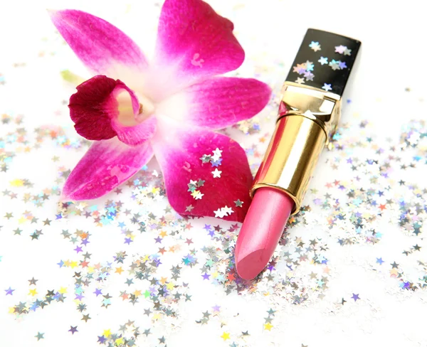 Rosa leppestift og blomst – stockfoto