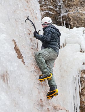 Man with ice axes and crampons clipart