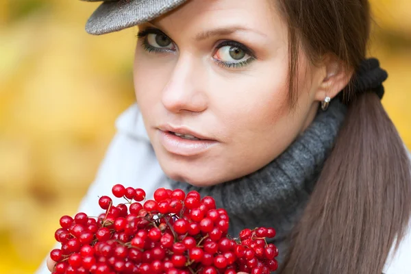 Beautiful woman portrait with viburnum berries — Stock Photo, Image